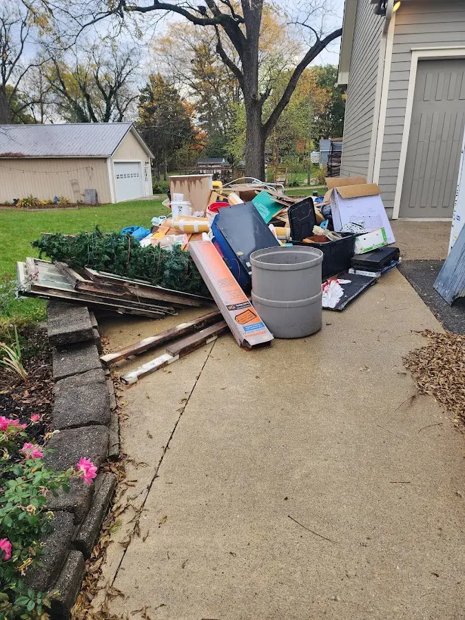 Dumpster being loaded with debris for 12 Yard Dumpster Rental in Ansonia
